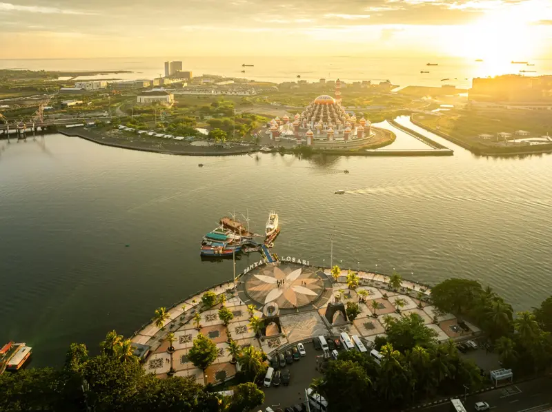 Losari Beach Makassar sunset with local food stalls and New Year lights