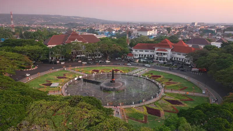 Malang city night view with New Year fireworks and Batu mountain background